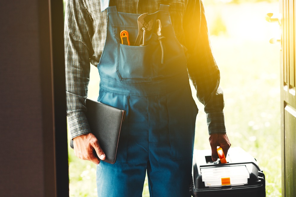 person with tool bag